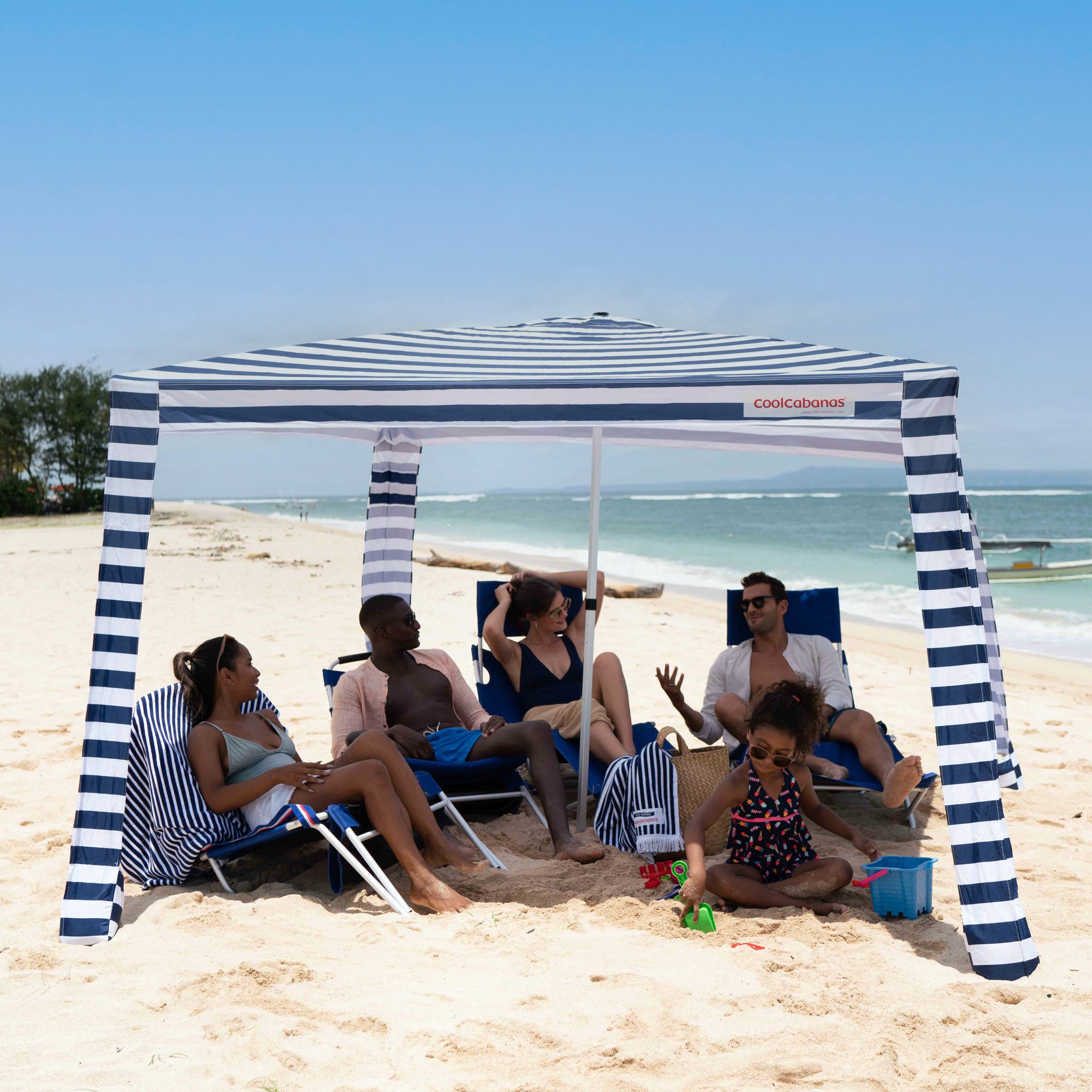 cool cabana with 5 people underneath#color_navy stripes