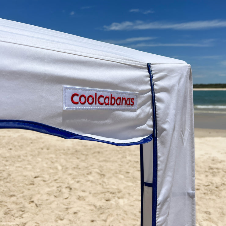 premium beach cabana coolcabana white and navy shot of logo trim red label